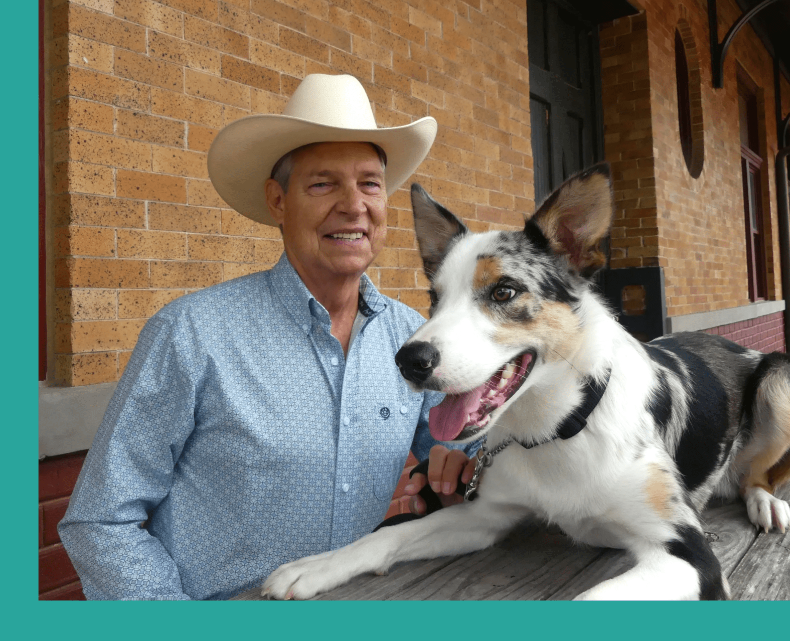 A man and his dog pose for the camera.